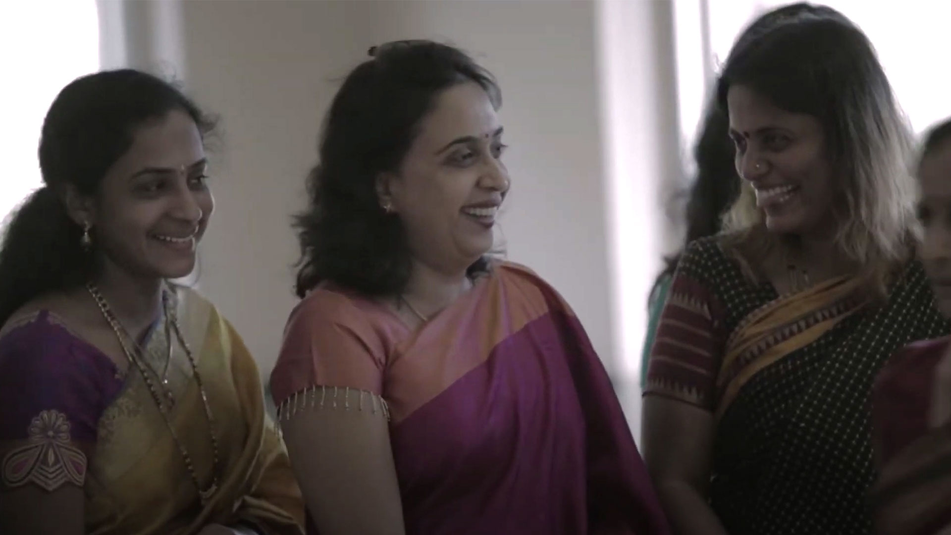 Usha Venkatesh, a data quality engineer, wears a traditional Indian dress called a Saree with two loved ones in a Hindu temple 