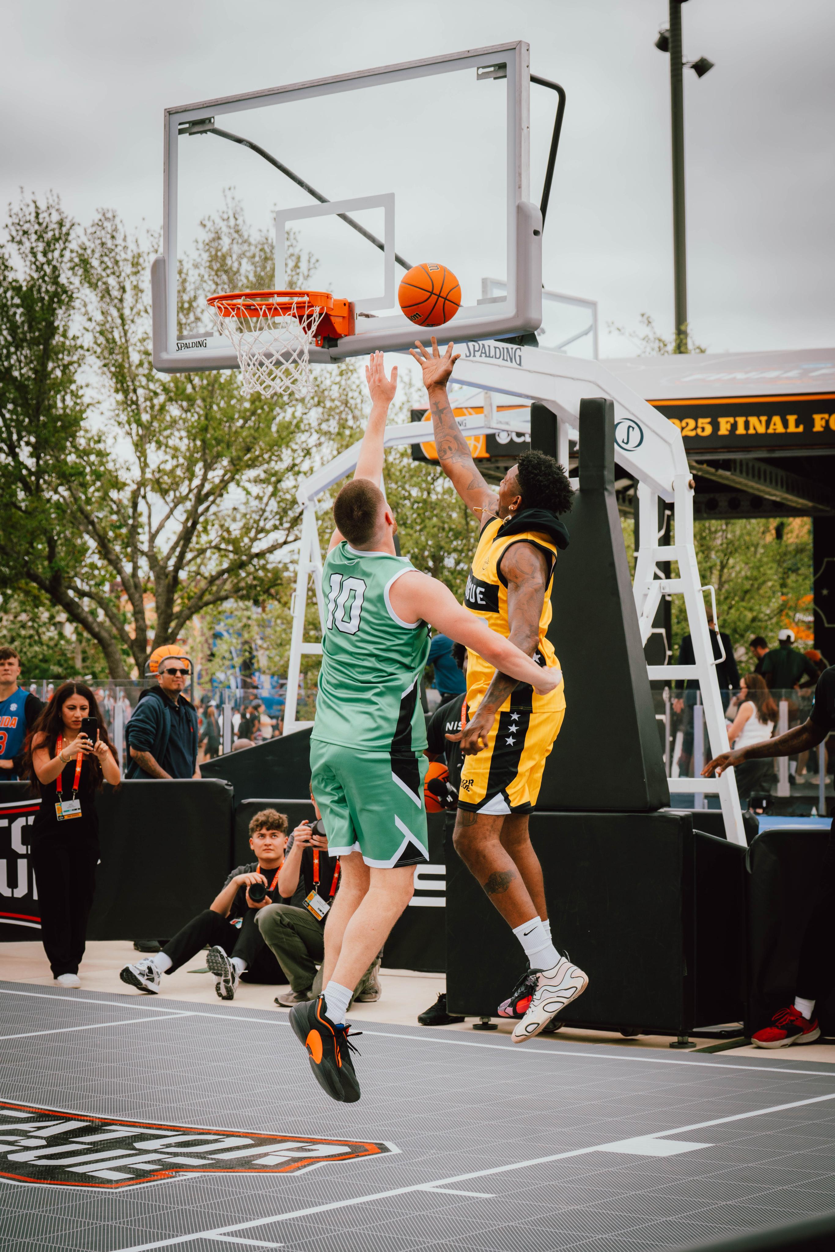 Shot of creator going up for a contested layup in the creators basketball game.